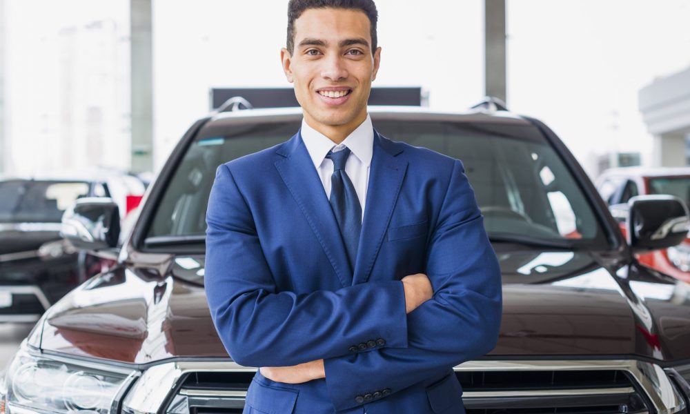 portrait-salesman-car-dealership